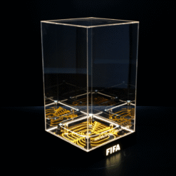 Clear acrylic trophy with a glowing orange patterned base and FIFA lettering on the front edge area.
