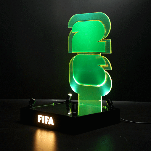 Green neon FIFA trophy on a black base, glowing against a dark background