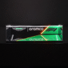 Long rectangular glass display with Aston Martin and Aramco branding, green and orange neon lines against a dark background (F1 graphic).