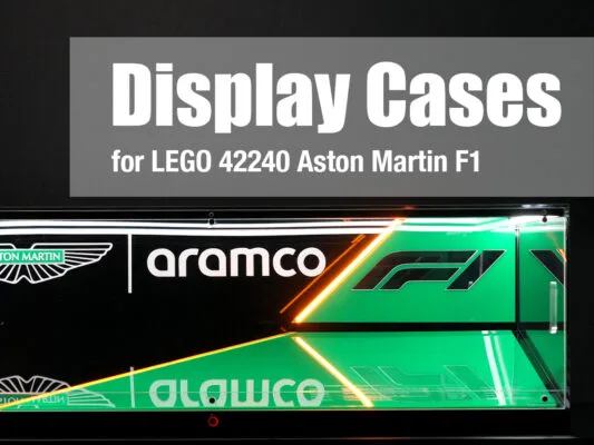 Display Cases for LEGO 42240 Aston Martin F1 above a black glass display with Aramco and Aston Martin branding in green and white logos of racing