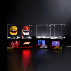 Left glass case containing yellow and red Ferrari F1 helmets, small figurines, and a red F1 logo panel beneath.